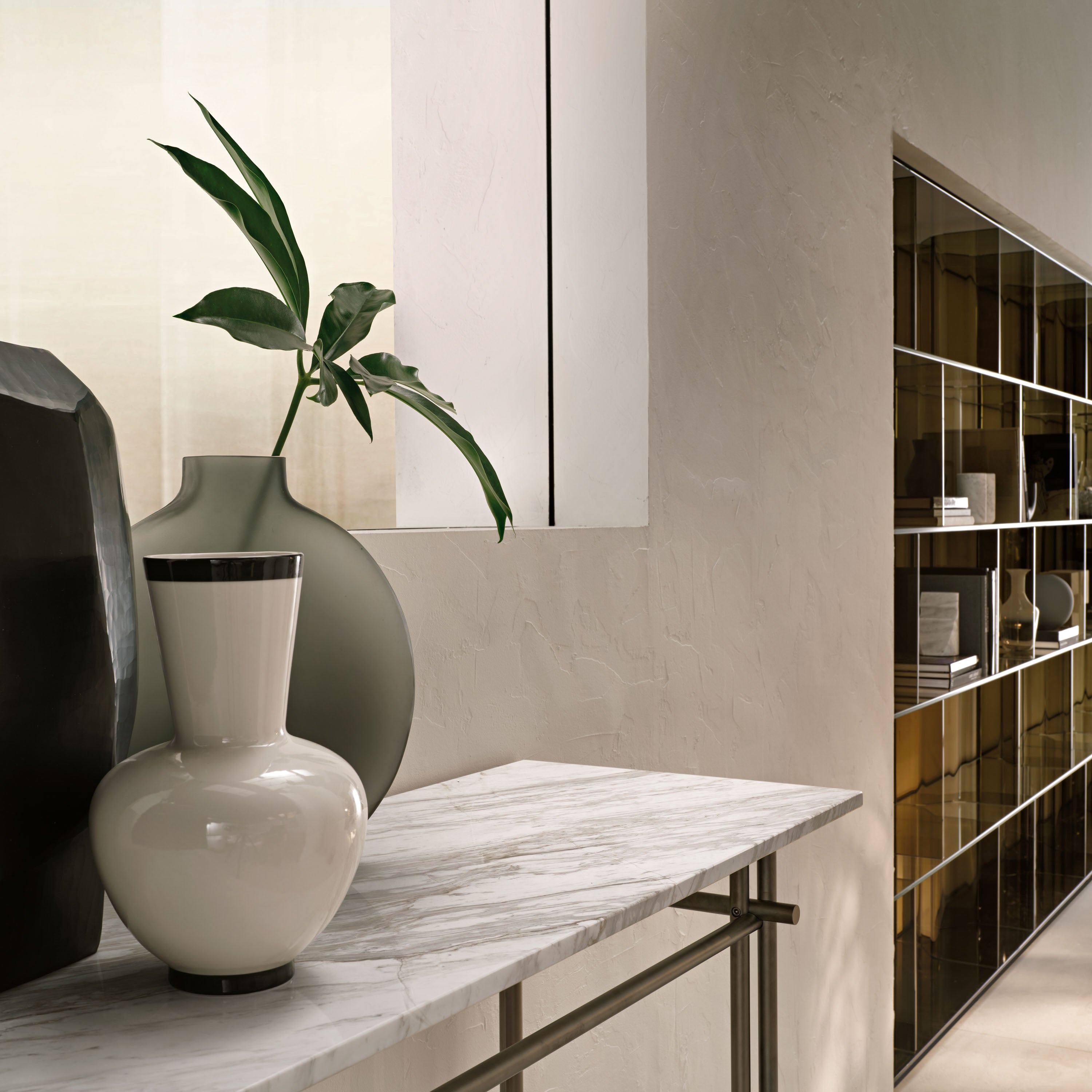 FIAM Cristaline console with a 15mm marble top and a matte titanium metal base, blending luxury and simplicity for elegant interiors.