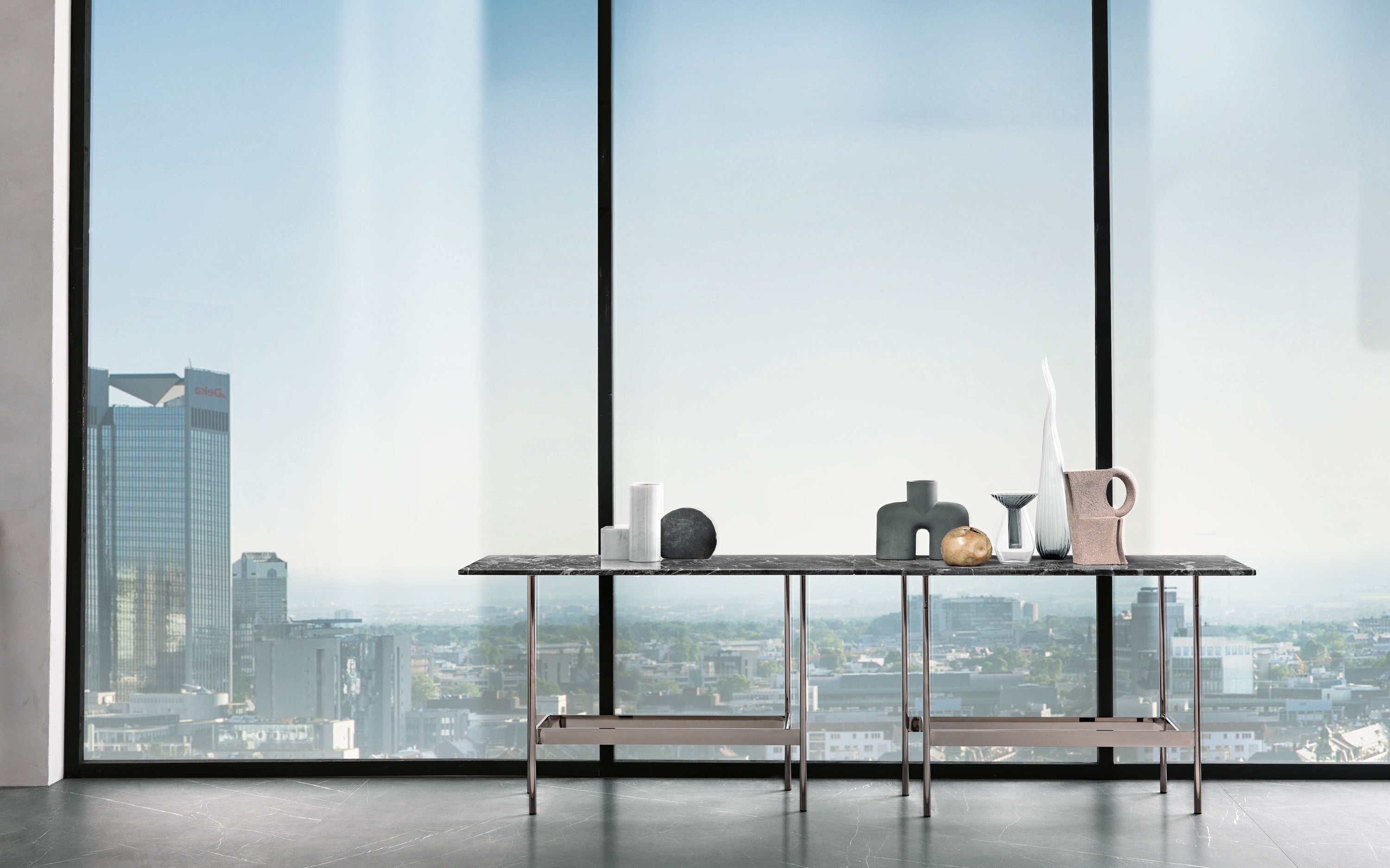 Waves Console by FIAM Italia with a Mystic Brown marble top and Black Glossy Nickel base, blending rich stone texture with sleek metal.