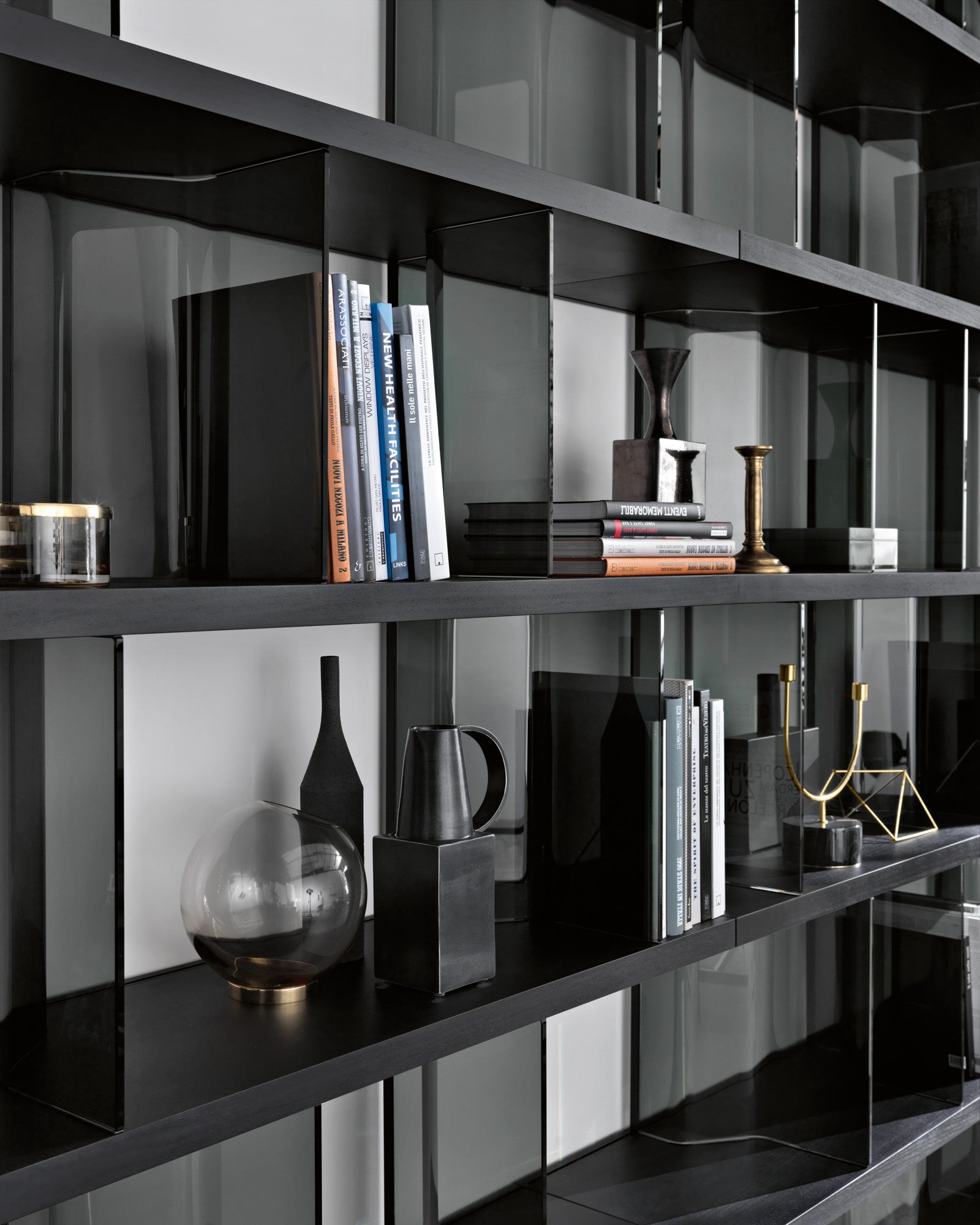 Fiam Inori bookcase installed as a wall-mounted unit, demonstrating its versatility in modern interior design.