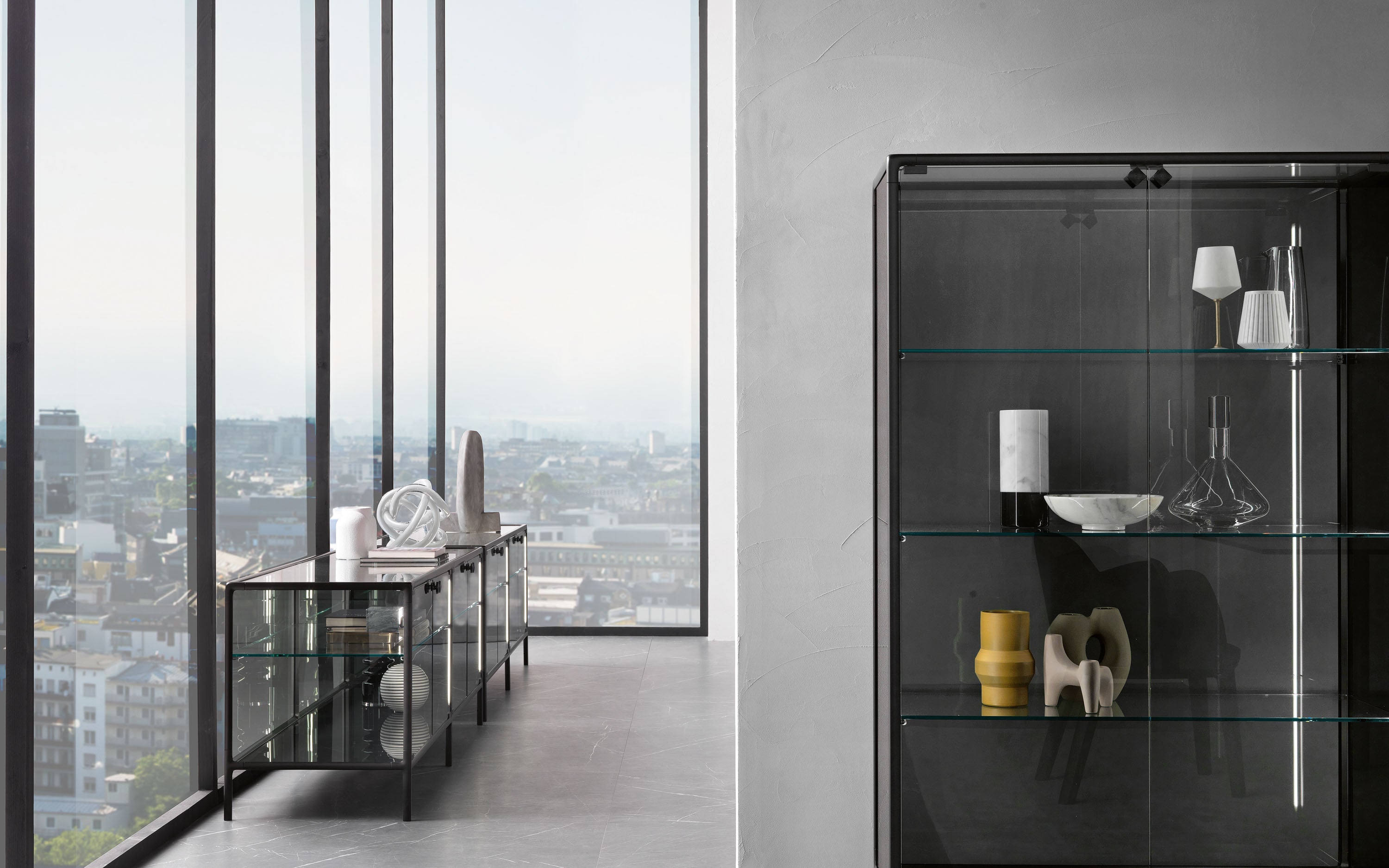 FIAM Echo glass showcase cabinet with extralight glass doors and vulcan grey aluminum frame, designed by Marcel Wanders Studio.