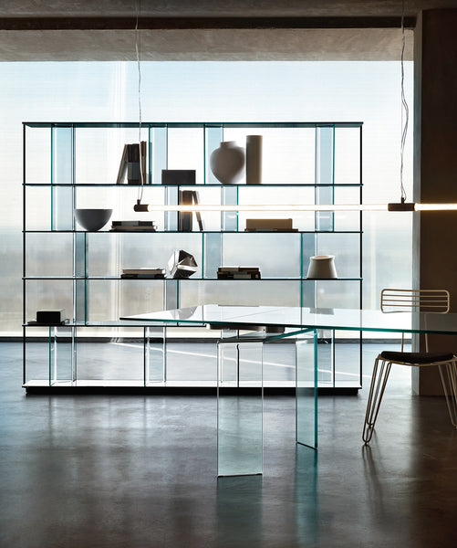 Fiam Inori modular bookcase integrated into a contemporary living room, serving as a stylish room divider