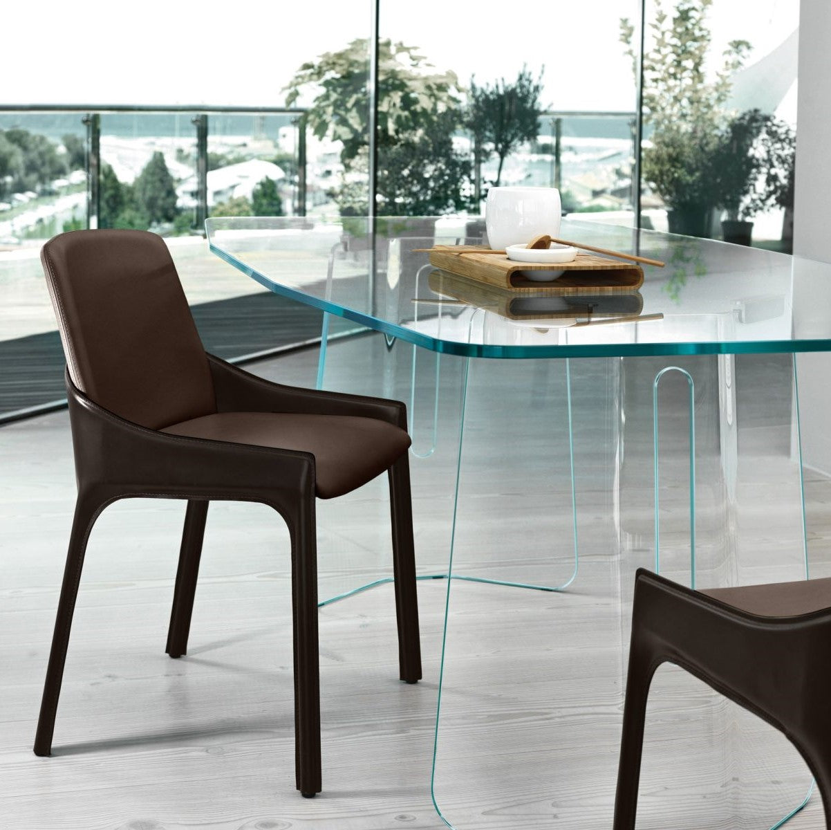 Modern glass dining table with brown chairs