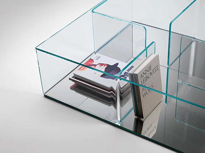 FIAM Quadra coffee table with curved glass structure and extraclear mirrored base designed by Matteo Nunziati.