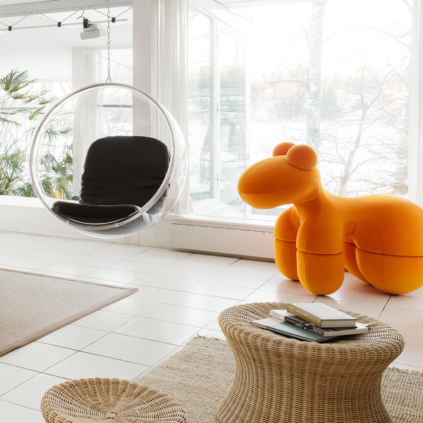 Eero Aarnio's Pony - orange fabric upholstered chair in modern interior