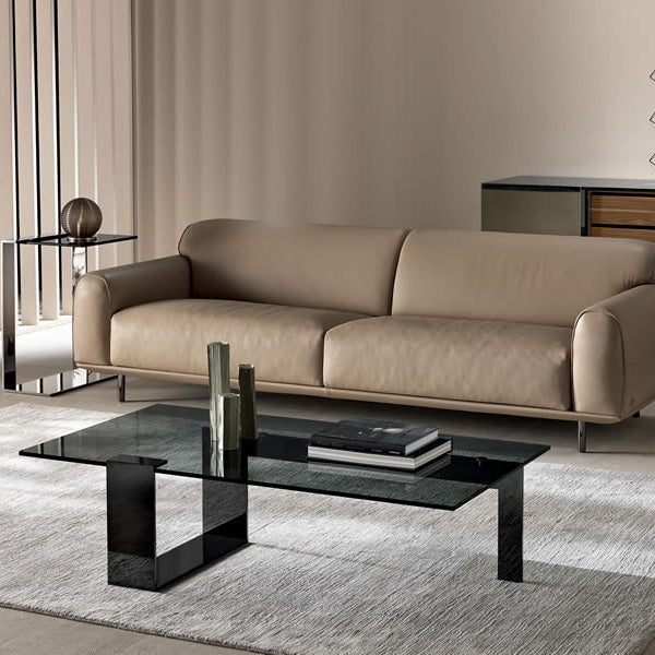 Black Frame Plinsky Coffee Table styled in a minimalist living room with a neutral rug, sofa, and decor on the smoked glass surface.